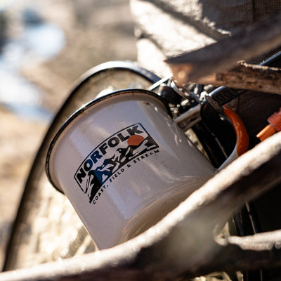 Camping mug on backpack